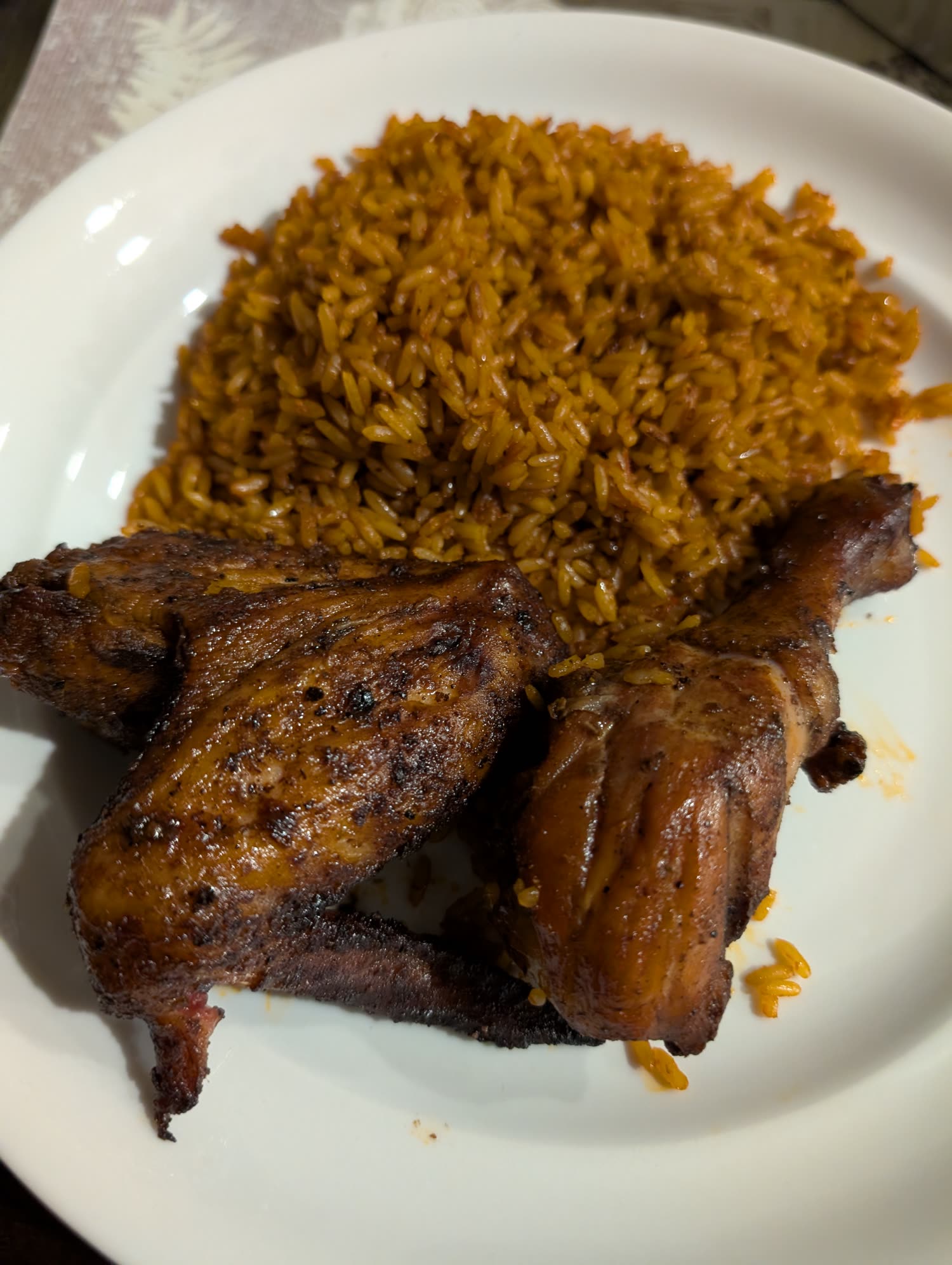 Jollof and smoked chicken plate